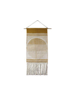 The MyHomeDecor.ca Hanging Tapestry - Ivory & Orange features a mustard yellow and white design. It has a semi-circle pattern with vertical lines extending downwards, creating a sunrise or sunset effect. Made of cotton and wood, the bottom has white fringe tassels, hung by a thin string attached to a wooden rod for an added vintage decorative style.