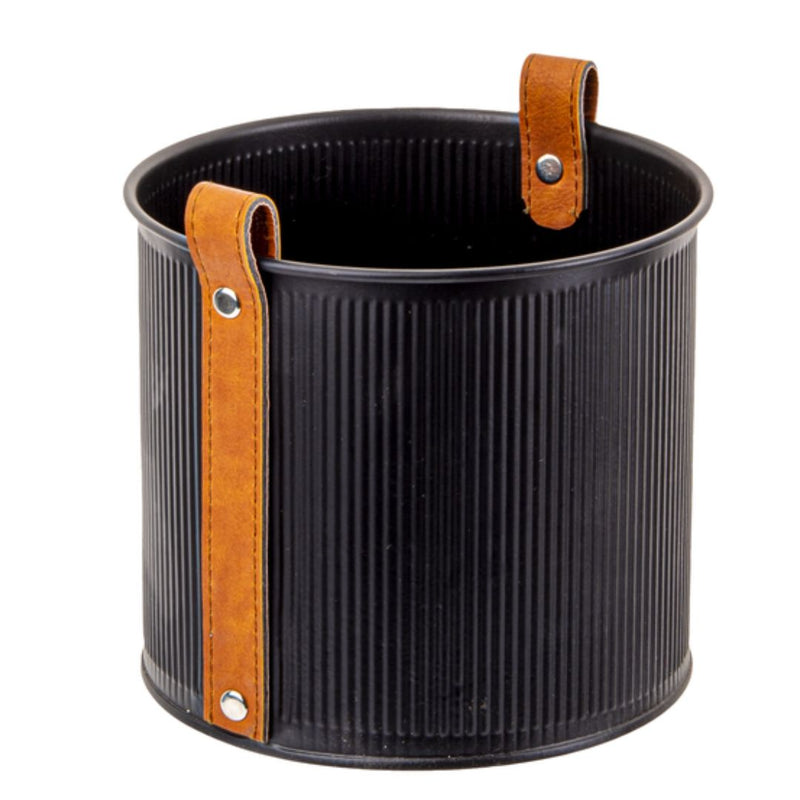 A **MyHomeDecor.ca Mini Planter with Leather Handle - Black - Small**, ideal as a mini planter, features two vertical brown leather handles attached with silver rivets on opposite sides. The empty small plant pot is set against a plain white background.