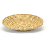 The Larde Round Tray - Coiled Grass by MyHomeDecor.ca, with its 17'' diameter, is a round, shallow basket made of woven natural fibers. It features a pattern of concentric rings and has a light brown color with a textured surface, making it perfect to display and store fruits while adding a rustic, handcrafted touch.