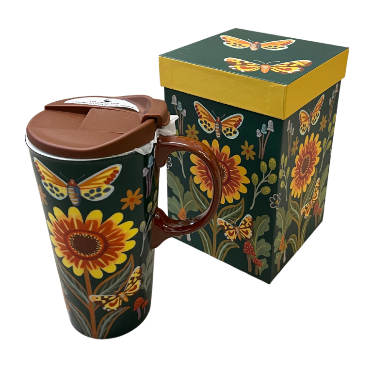 A Ceramic Travel Cup - Folk Forest featuring a brown lid and sunflower and butterfly designs, part of the Spring Collection from MyHomeDecor.ca. It comes with a matching gift box adorned with the same motifs on a dark green background, complemented by a yellow lid edge.