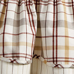 Close-up of a plaid and stripe pattern fabric featuring red, yellow, and gray lines on a white background. The fabric appears to be gathered at the top with loose folds, possibly an interior decoration like the Lined Layered Valance - Kingswood by MyHomeDecor.ca.