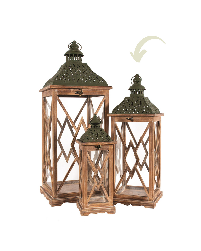 Three brown wood lanterns of varying sizes with green metal roofs and glass panels featuring crisscross patterns, arranged together on a white background. The largest lantern is on the left, and an arrow points to the Medium Wooden & Metal Lantern - Brown & Green from MyHomeDecor.ca on the right.