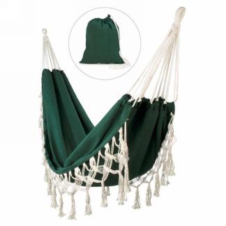 A MyHomeDecor.ca Hanging Hammock With Pouch - Green with white braided edges and tassels is displayed, exuding a bohemian-chic style. A matching green drawstring carry bag is shown inset in the upper section of the image, indicating that the hammock is portable and can be folded into the bag.