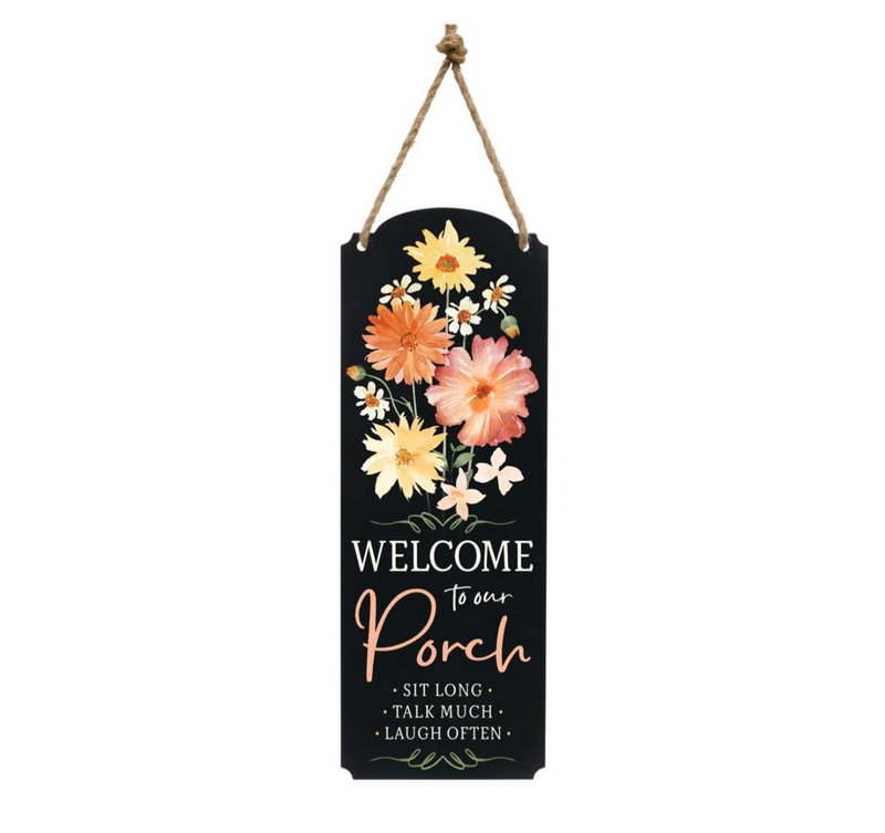 A decorative black sign with a flower bouquet at the top. The text reads: "WELCOME to our Porch - Sit Long - Talk Much - Laugh Often." This charming MyHomeDecor.ca Wall Decor - Welcome Flower hangs from a sturdy brown rope, making it perfect for both indoor and outdoor use.