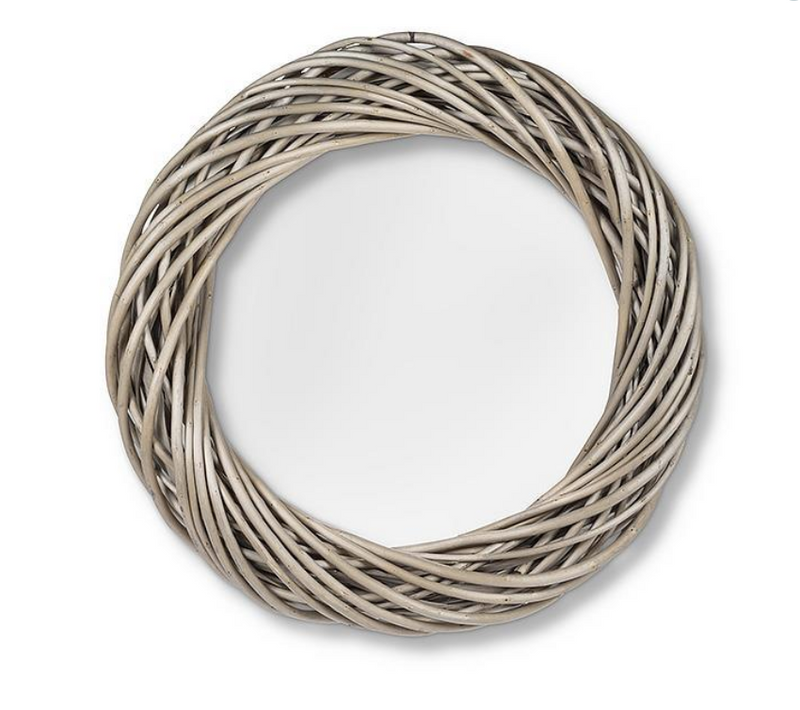 The MyHomeDecor.ca Medium Woven Wreath - Natural is made of intertwined, whitewashed twigs arranged in a circular pattern, with a hollow center. The design is simple and rustic, showcasing the natural texture of the twigs, perfect for adding charm to any accent wall.