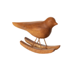 A **Large Bird on Rocker - Brown** by **MyHomeDecor.ca** with smooth curves is perched on a pair of small wooden rocking runners. The bird and base are crafted from light-colored wood, giving this wooden decoration a natural and minimalist appearance.